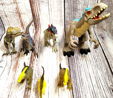 Dinosaur Lot of 7. Only 4 has Joints, includes 2 W/Lights  Sound effects .....