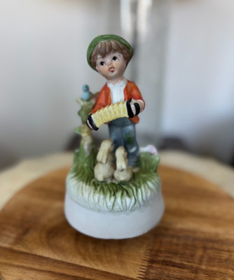 Vintage Porcelain Music Box featuring a Boy a Blue Bird  and a Rabbit