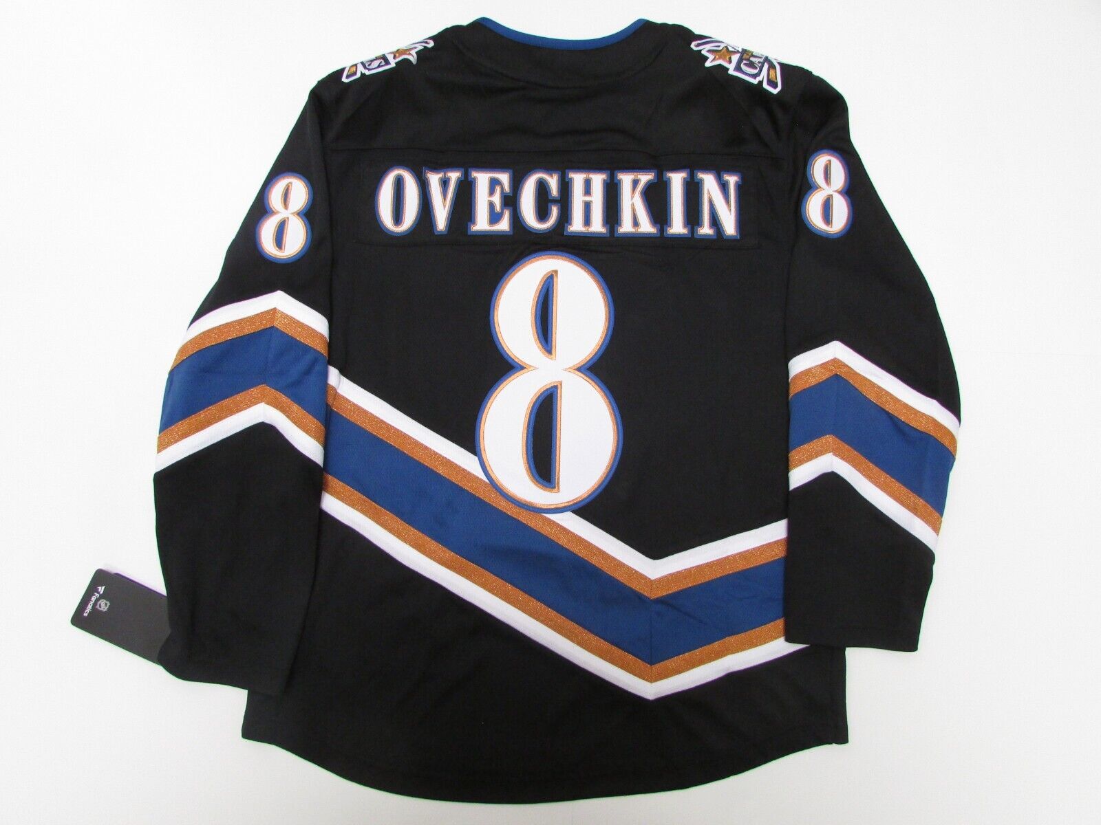 The ad placement on Ovechkin's Reverse Retro jersey is actually on the left  of the C for the game. : r/hockey