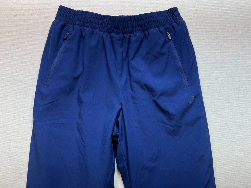 Pantalones de chándal para hombre Asics forrados de lana talla mediana azul bolsillos con cremallera al aire libre Foto 4 de 4