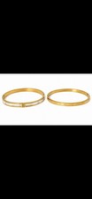 Women's Bracelets Gold Tone Oval Hinged Bangle Bracelets Set of 2.