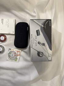 Sony PSP 1001 PlayStation Portable With Charger, new battery and 2 games.Works!!