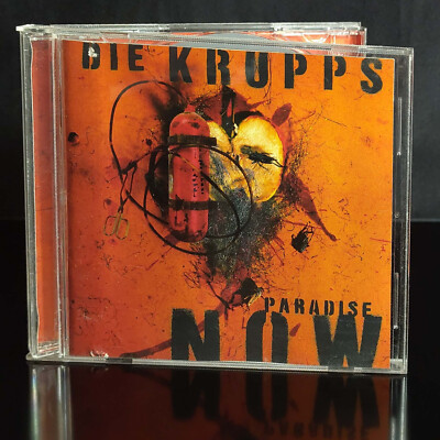 DIE KRUPPS - Paradise Now - 1997 Zustand: Sehr Gut
