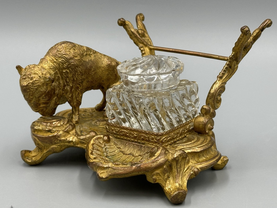 A full Victorian brass buffalo/bison desk stand with inkwell and pen rack — wildly specific, deeply weird, and absolutely unforgettable as a Western desk statement piece.
