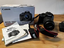 Canon EOS 100D Digital SLR Camera with 18-55mm lens, manual and charger