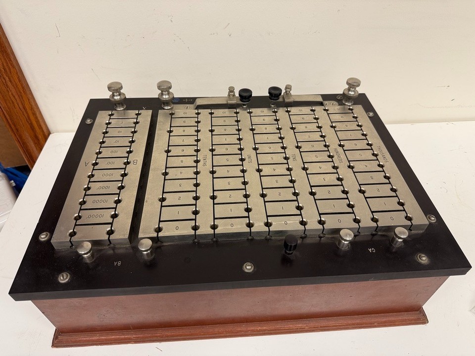 A mahogany-and-brass Leeds & Northrup Wheatstone Bridge — precision electrical testing equipment from the golden age of measurement science, gorgeous enough to frame.