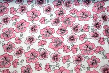 PINK FLOWERS WITH BLACK ACCENTS ON WHITE - 100 COTTON FABRIC