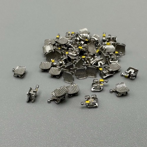 50 pezzi staffe ortodontiche dentali staffe STD MBT 022 slot 3 ganci metallo sfuso - Foto 21 di 24