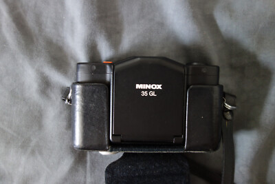 MINOX 35GL outfit including MT35 flash, Olympus flash, leather cases
