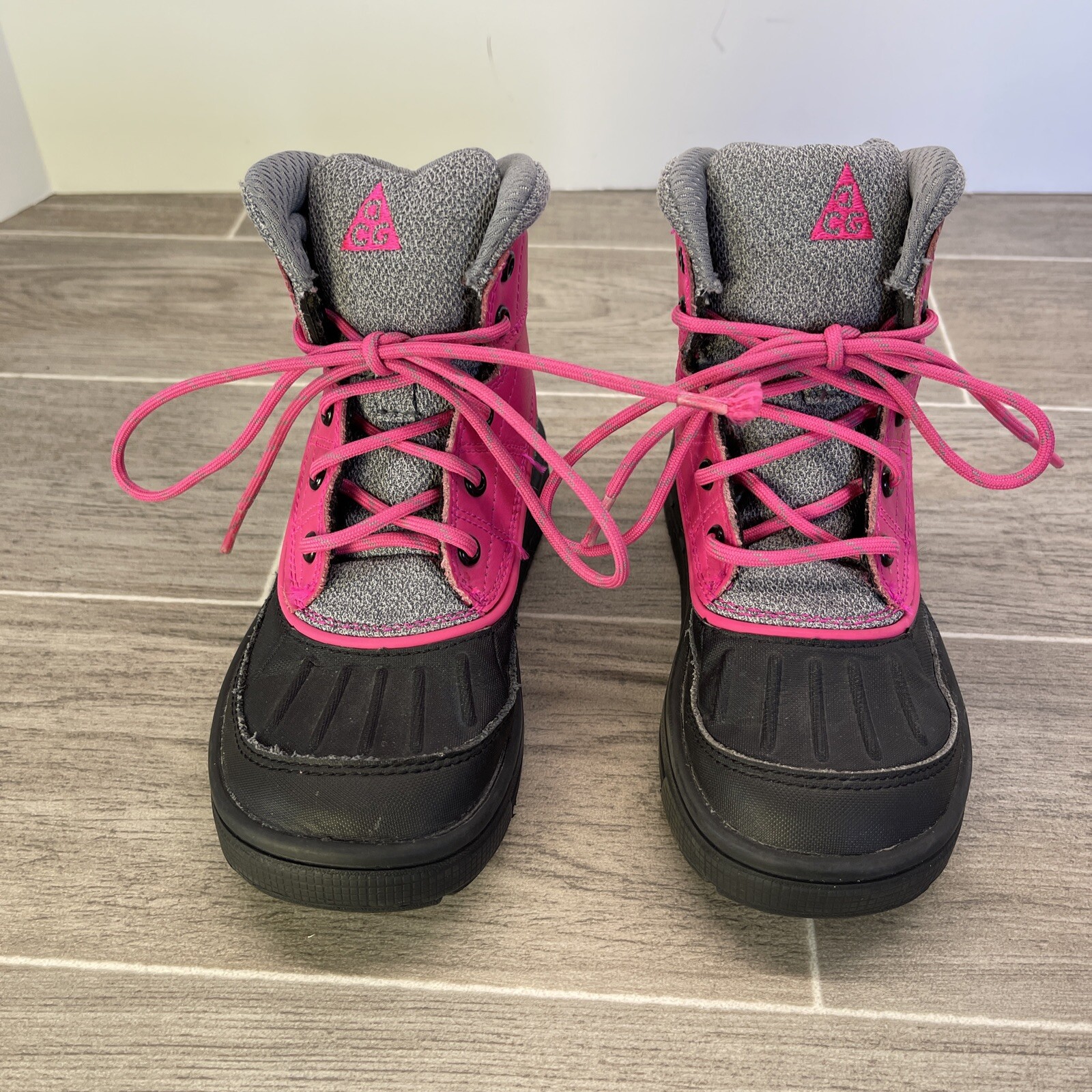 black boots with pink laces