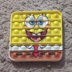 Nickelodeon SpongeBob SquarePants Silicone Pop It Fidget Toy Yellow/White/Brown — photo 1