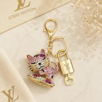 Authentic Louis Vuitton Lock & Key w/ Unbranded Sleeping Cat Bagcharm, Keychain