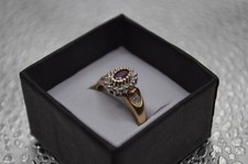 9ct Yellow Gold Ring With Red Centre Stone And White Stone Halo stones .14 2.72