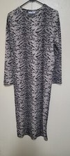 SARA TRAFALUK BELTED ANIMAL PRINT MIDY DRESS ( NOTE GOES WITHOUT A SEATBELT)
