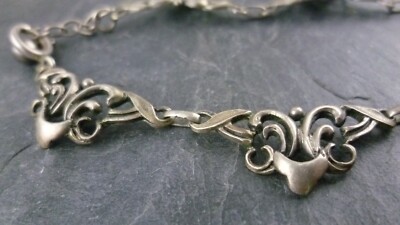 Kette mit kunstvoll gestaltete Glieder 835er Silber