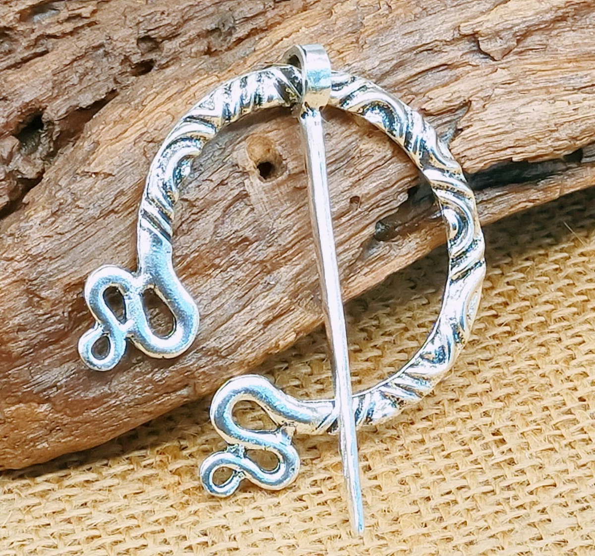 Penannular brooch shop