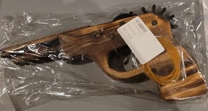 TOY RUBBER BAND RACHETED WOOD PISTOL.