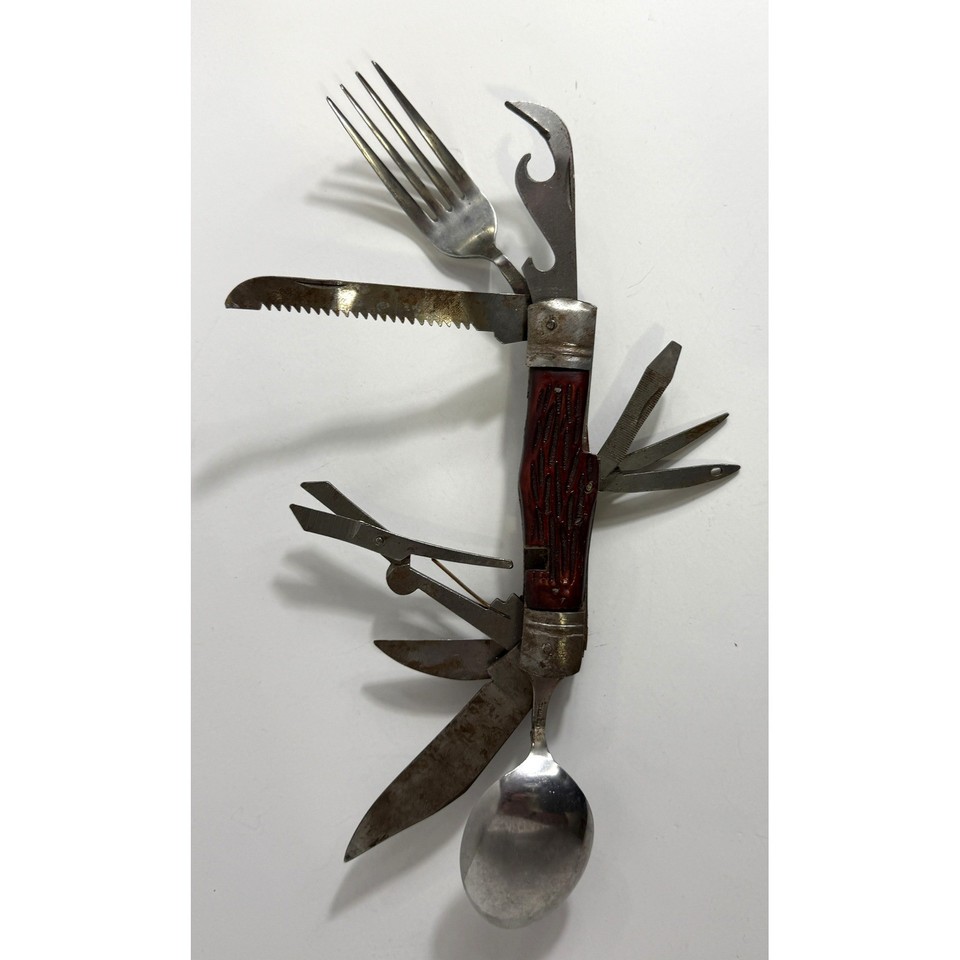 A 10-blade Victorian-style multi-tool with fork, spoon, saw, and more — a complete antique survival kit that looks like it belongs in a museum vitrine.
