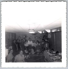 Vtg B&W Snapshot Group Family Party In Basement Bar With Food Table Bar Circa