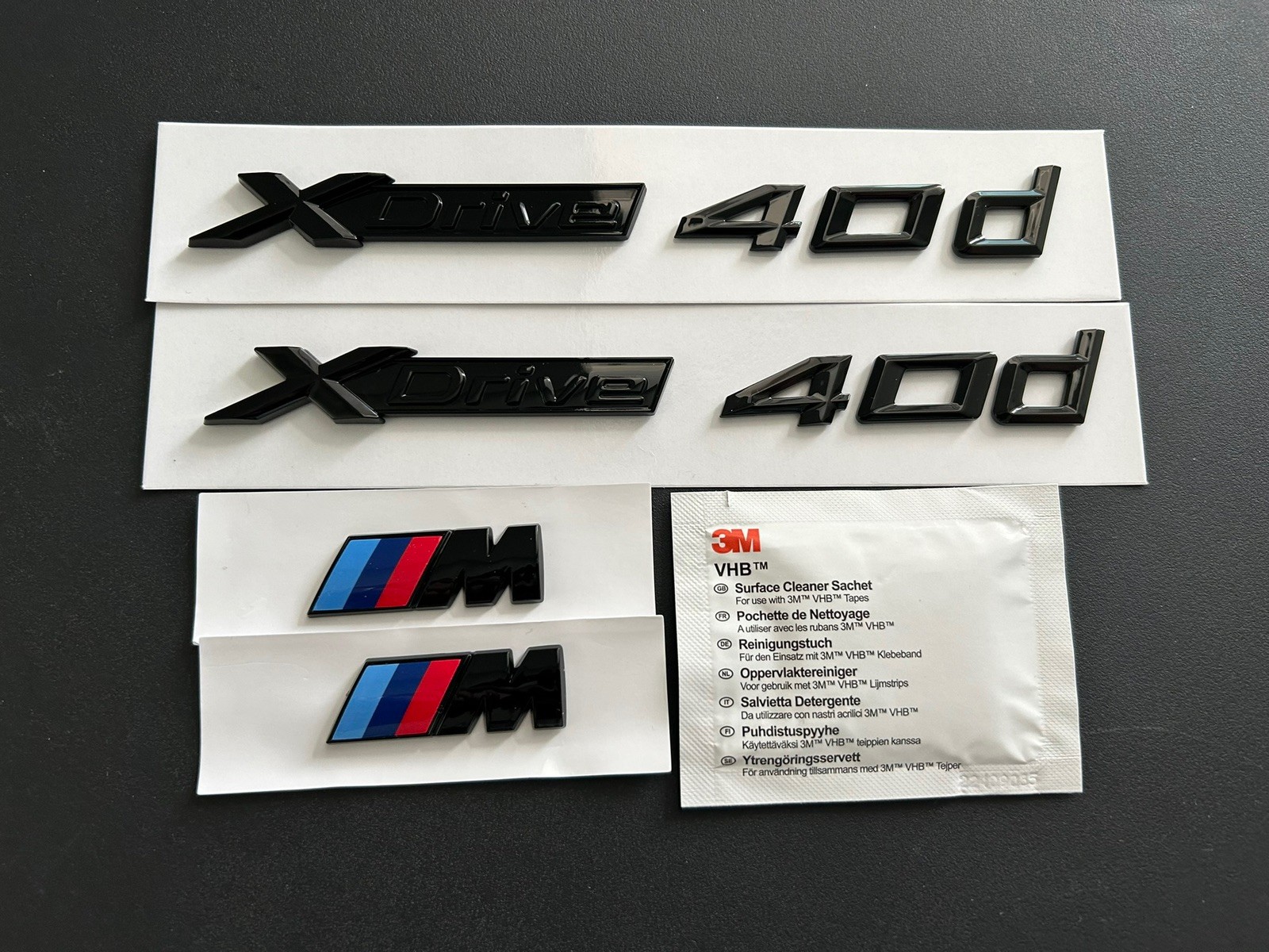 2X BMW Xdrive 40d AND 2X M WING BADGES IN GLOSS BLACK. FREE ALCOHOL WIPE