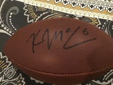 autographed Kellen Moore Football, Dallas Cowboys in a case
