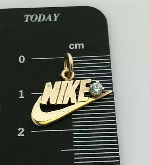 Nike 2024 gold charm