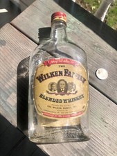 Labeled Whiskey Flask ?Wilken Family? Portrait On Cap Pint Size