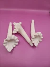 A trio of Fenton hobnail milk glass epergne horns with ruffled rims.