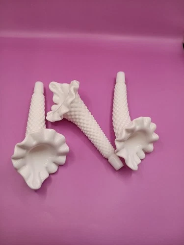 A trio of Fenton hobnail milk glass epergne horns with ruffled rims.