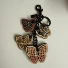 COACH Butterfly Motif Charm Keychain