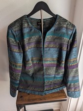 Studio I blazer features a patterned tapestry design in teal, purple, and green.