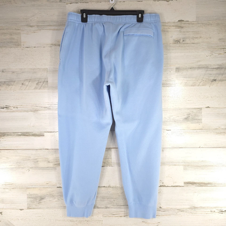 PANTALONES JOGGER NIKE AZUL CLARO POLAR PARA MUJER Talla XL BOLSILLOS CON CORDÓN pequeña mancha Foto 2 de 4