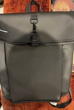 Bagbase black polyurethane rolltop backpack featuring a metal hook fastener.