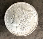 1879 Morgan Dollar, uncirculated, ungraded-priced accordingly, 2 different looks