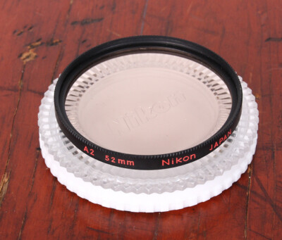 ② NIKON FILTER, 52MM PALE ORANGE A2, WITH PLASTIC CASE/218223