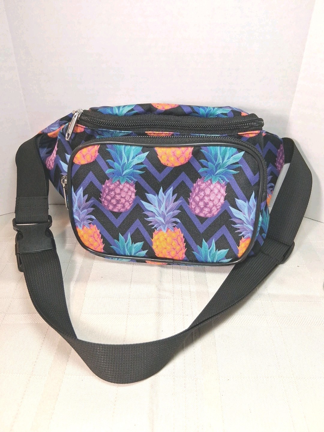 Colorful pineapple print women's fanny pack with adjustable strap and 2 zipper pockets