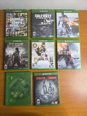 Lof of 8 Xbox One Games Call Of Duty Ghosts GTA 5 EVOLVE, Battlefield, Lego, NHL