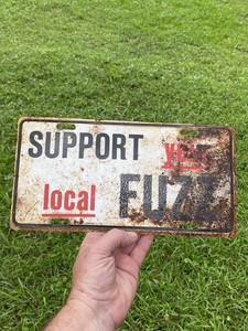 RARE VINTAGE STEEL SUPPORT YOUR LOCAL FUZZ BOOSTER LICENSE PLATE TAG POLICE BIKE