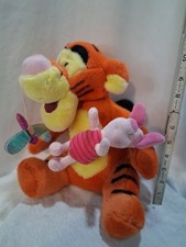 Disney Store talking Tigger toy featuring a detachable Piglet and a sparkly