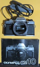 OLYMPUS OM-10 35mm SLR Film Camera Body Only Silver w/ Manual & Strap