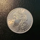 1885 O Morgan Silver Dollar XF+/AU