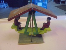 Vintage tin Pickwick Toy Co. Children on swing teeter totter