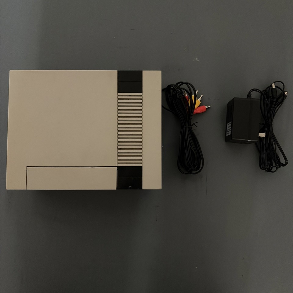 An original 1985 NES — the console that defined a generation — tested and working means you can plug it in and actually play Duck Hunt tonight.