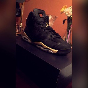 black and gold 6's