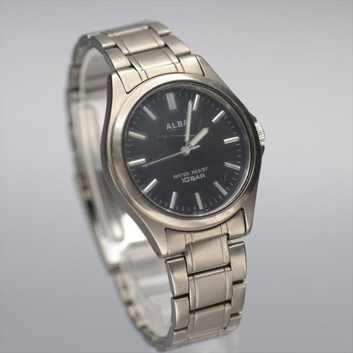 SEIKO ALBA V501-0B00 titanio resistente all'acqua 10 bar quadrante nero roton... - Foto 2 di 8