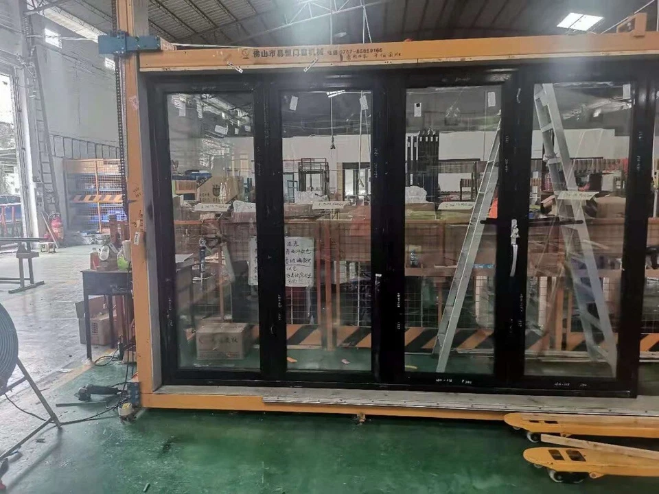 Puerta corredera plegable doble de aluminio para patio (varios tamaños) Foto 4 de 4