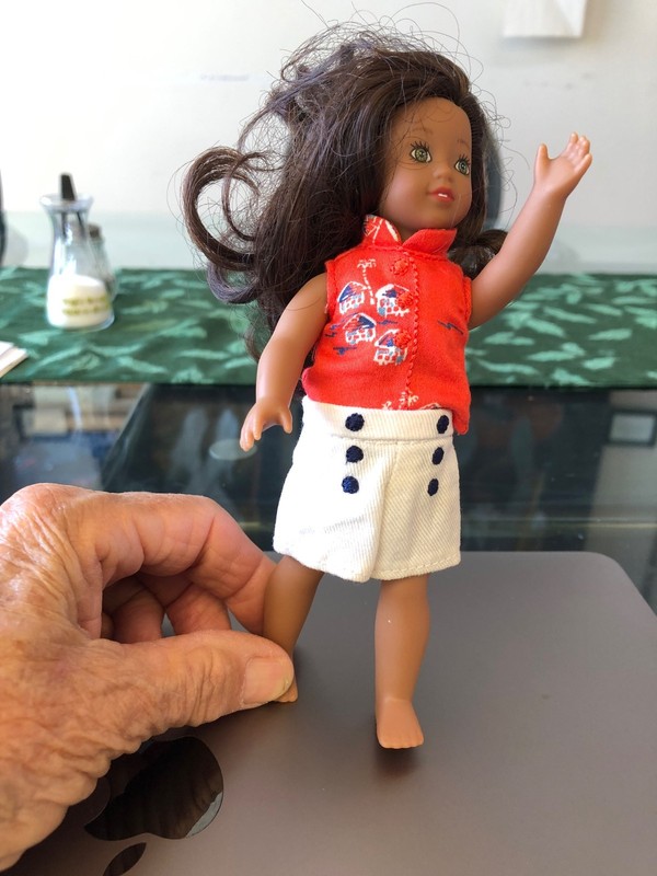American Girl Nanea in her meet outfit, shirt, shorts, and white undies