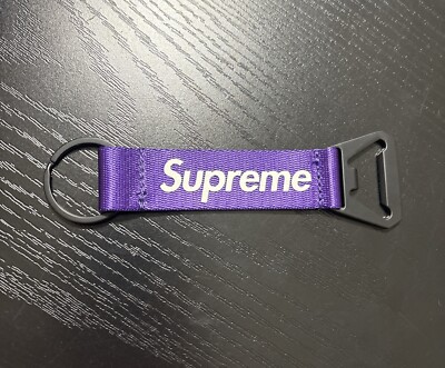 SUPREME BOTTLE OPENER WEBBING KEYCHAIN PURPLE FW21