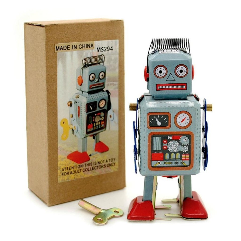 A 4.5" wind-up litho tin robot — the classic retro collectible that looks straight off a 1950s toy shelf.