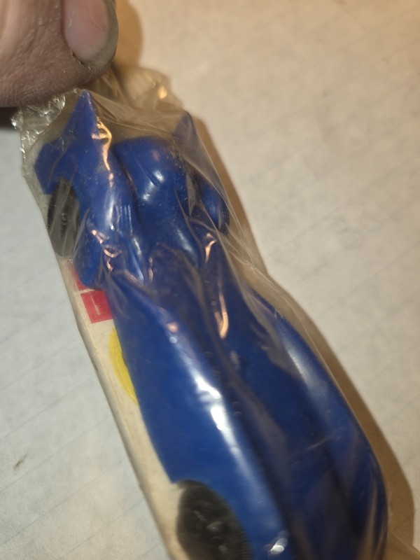 vintage blue plastic toy race car produced by JVZ Co. in the 1960s or 1970s.